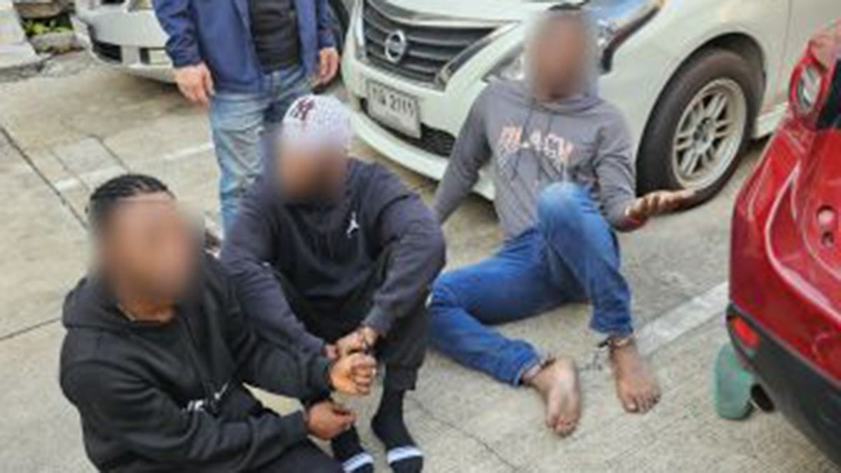 Suspects on ground in handcuffs