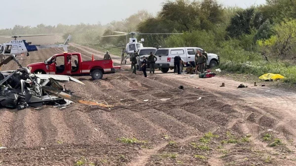 Authorities at helicopter crash site