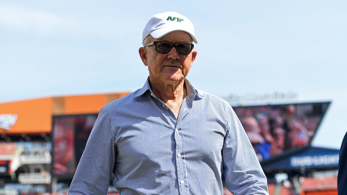 New York Jets owner Woody Johnson walks on field