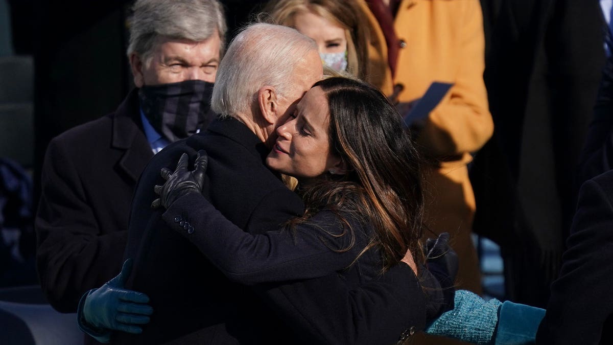 ashley biden hugs father joe