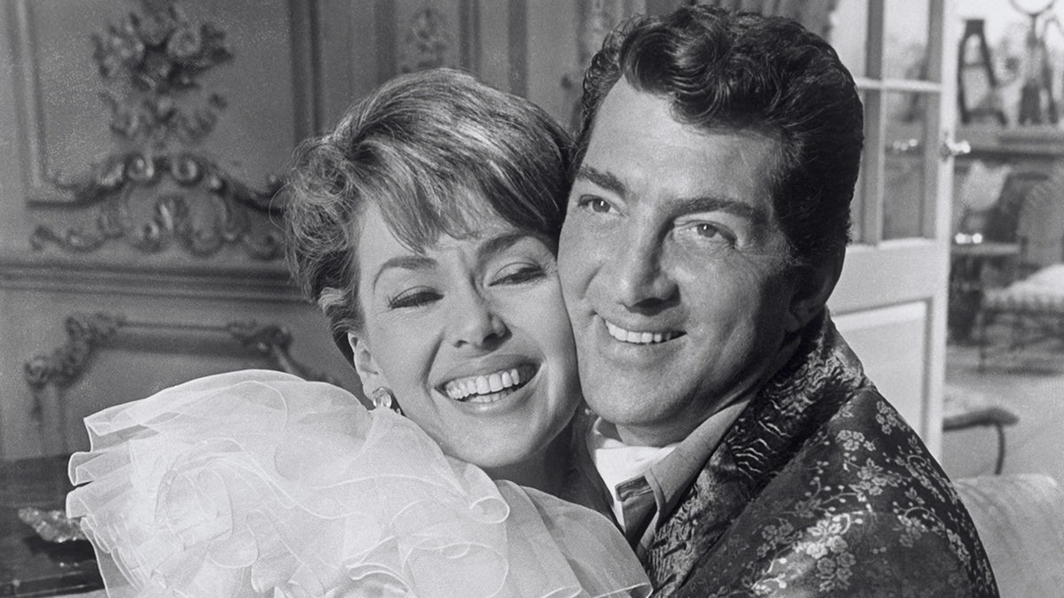 Actress Barbara Rush embraces Dean Martin in 1964 film.