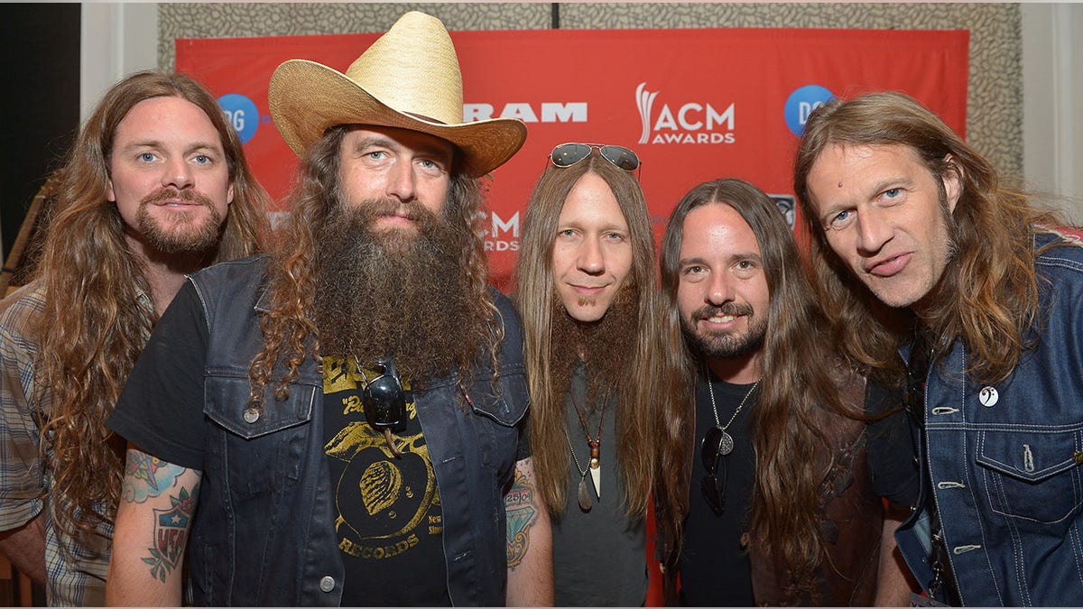 Brandon Still, Brit Turner with a huge cowboy hat, Charlie Starr, Paul Jackson, and Richard Turner at the Dial Global Radio Remotes