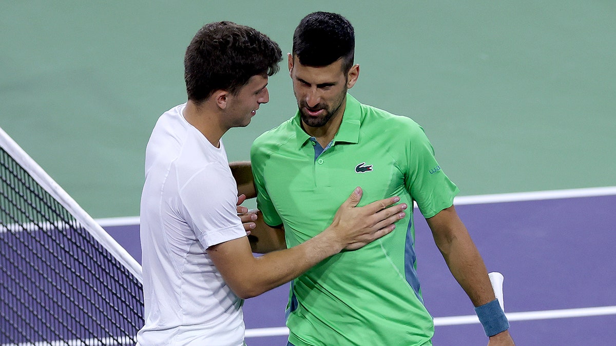 Luca Nardi and Novak Djokovic shake hands