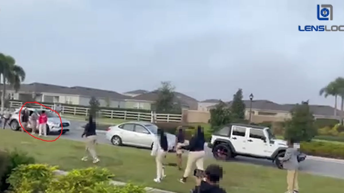 Video still shows the fight starting between two students