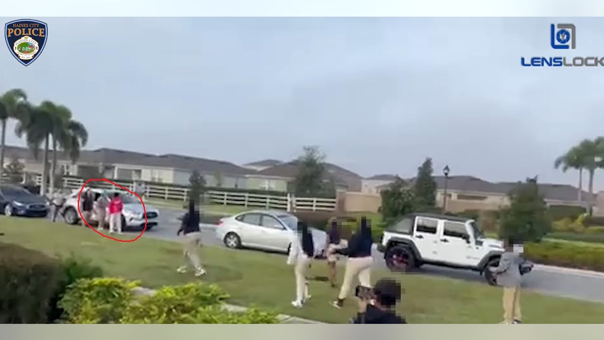 Video still shows the fight starting between two students
