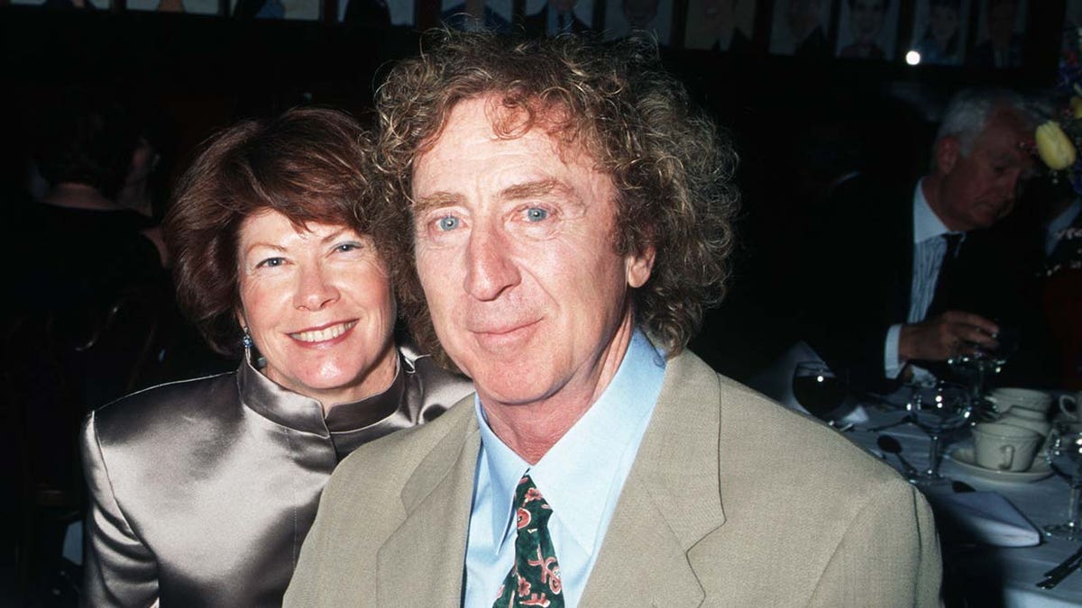 Gene Wilder and wife Karen Boyer smile at dinner