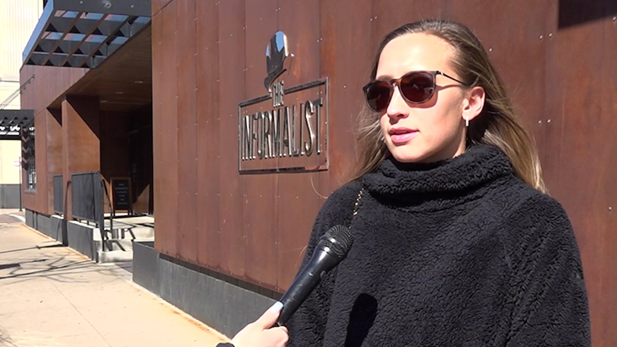 White house a girl in sunglasses talks in front of mic 