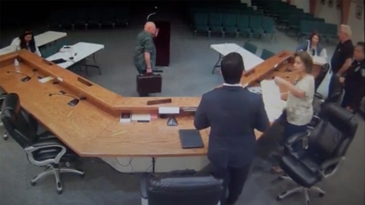 Security video of city council dais, Mayor Trevino, Gonzalez, and police officer