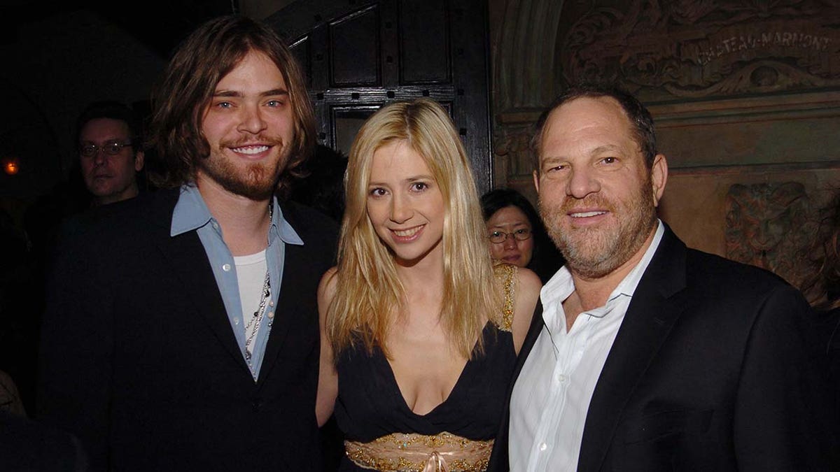 Mira Sorvino embraces Harvey Weinstein at Hollywood party