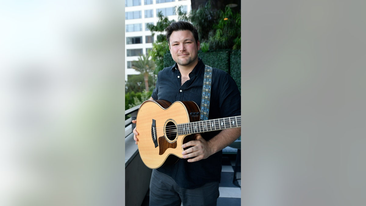 Ian Flanigan with guitar