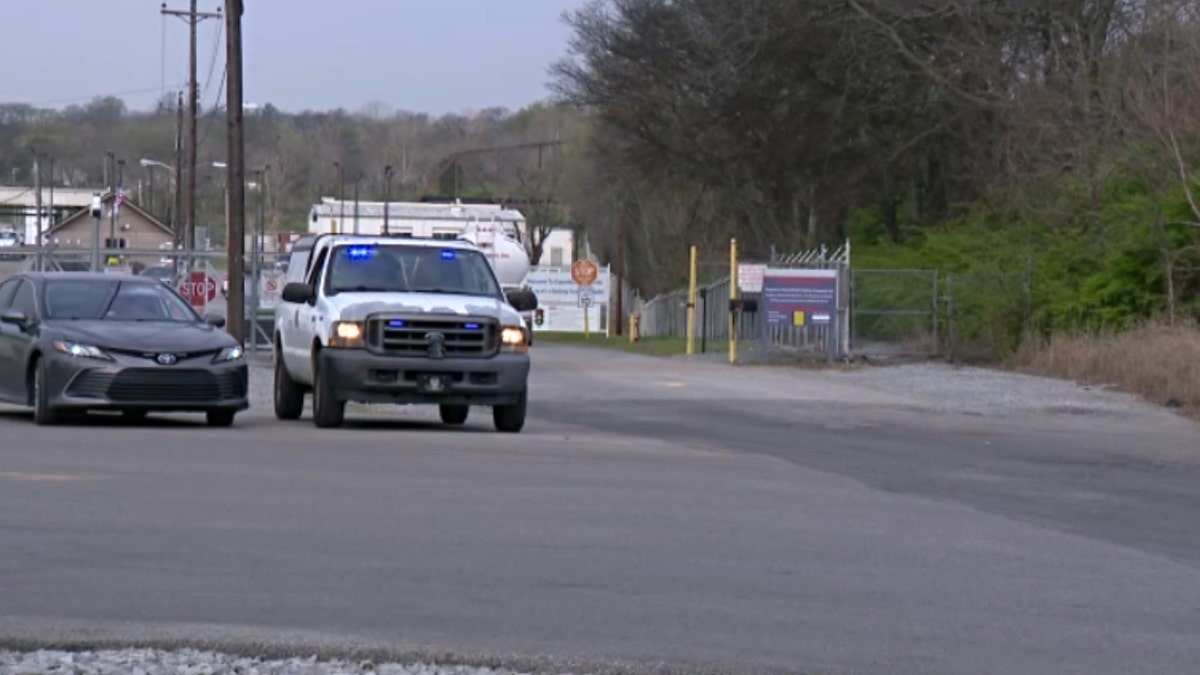 Police vehicles gather near the scene of a press conference where MNPD Chief Drake announced the discovery of Riley Strain's body