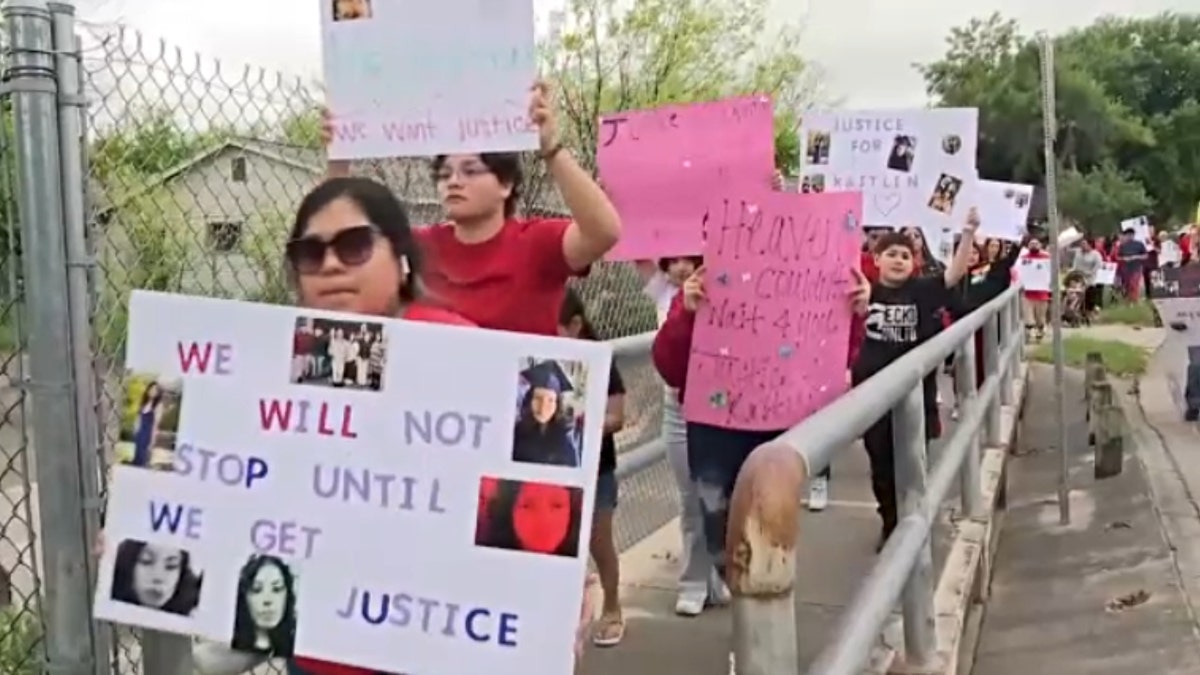 People marching for Kaitlin Hernandez along Dell Oaks Drive in San Antonio, Texas