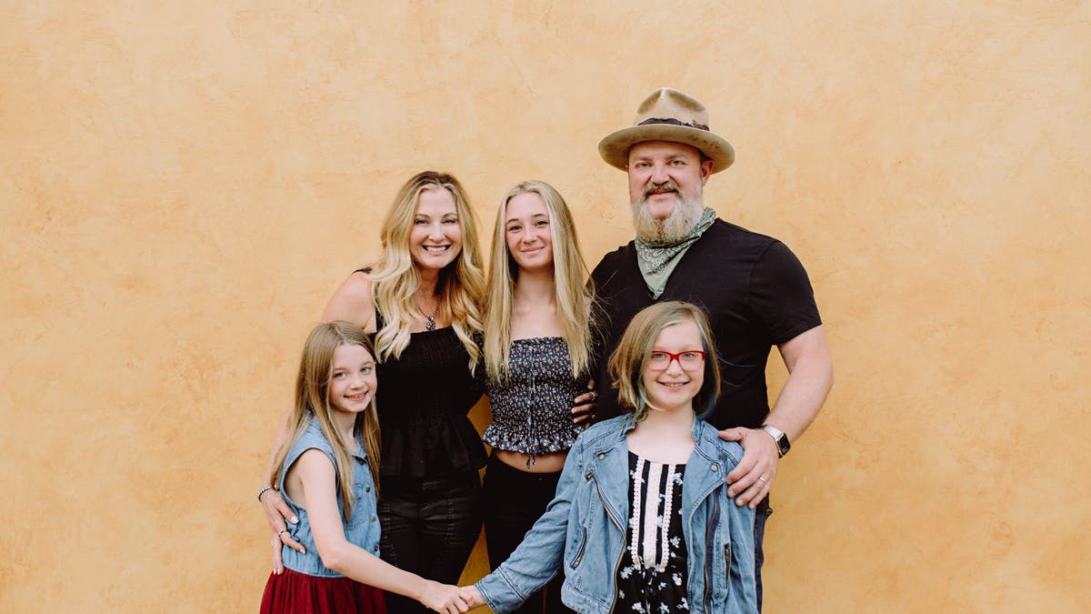 A photo of John Driskell Hopkins with wife and kids