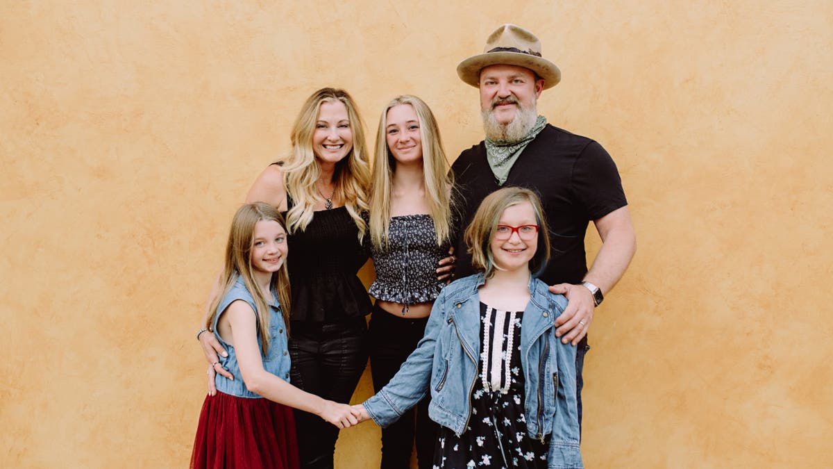 A photo of John Driskell Hopkins with wife and kids