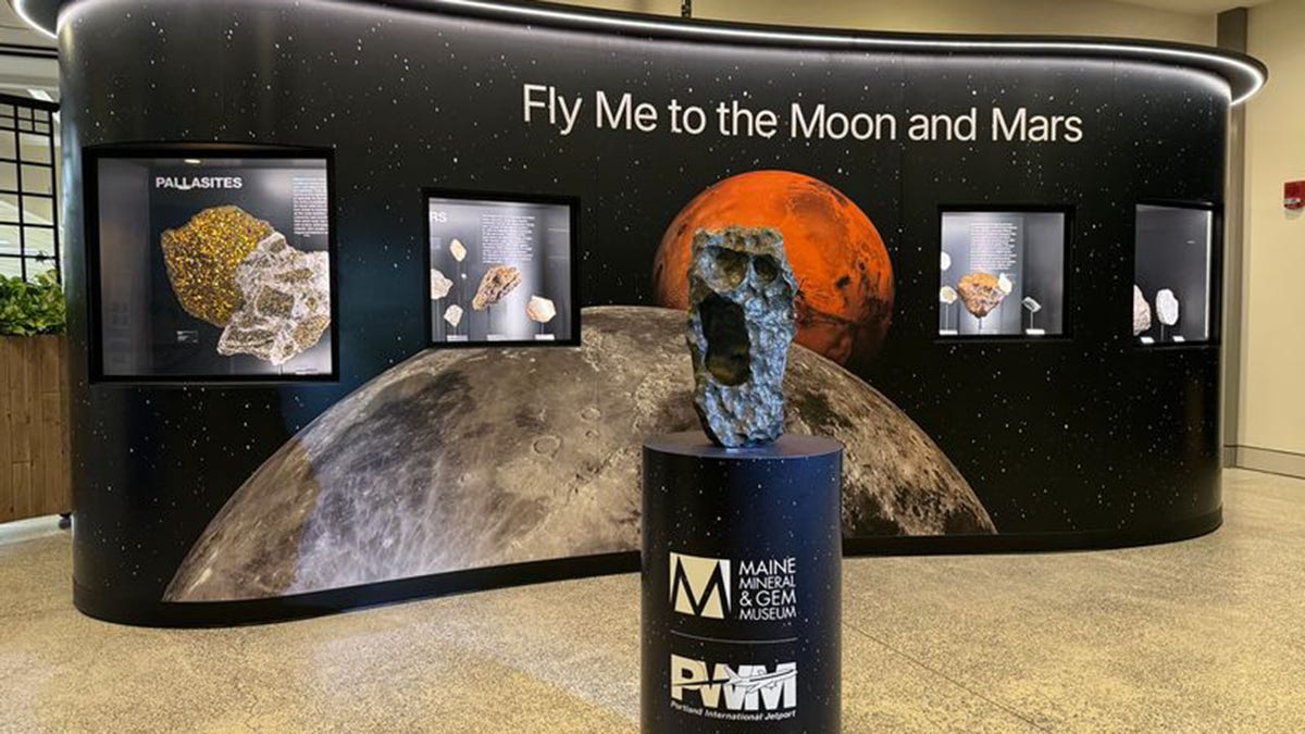 The fly me to the moon and mars exhibit at the Portland International Jetport