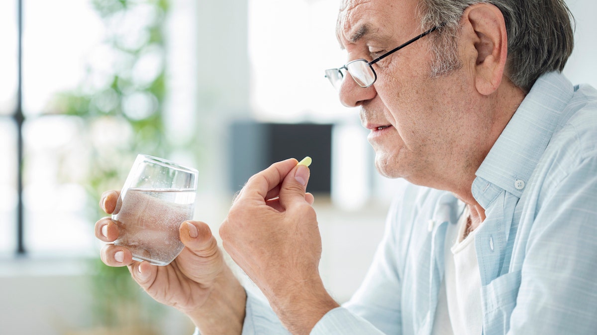 Man taking medicine