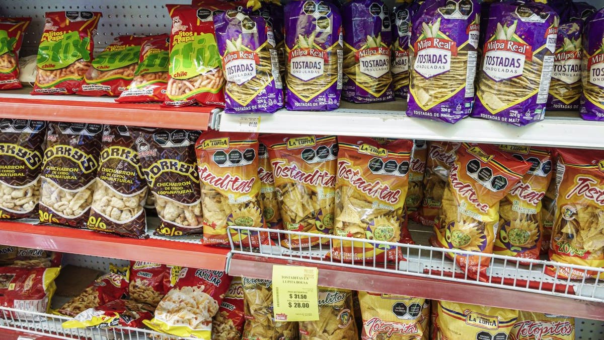 Bags of pork rinds connected shelf