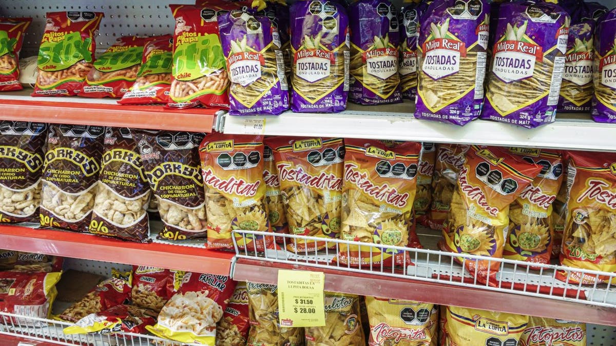 Bags of pork rinds on shelf