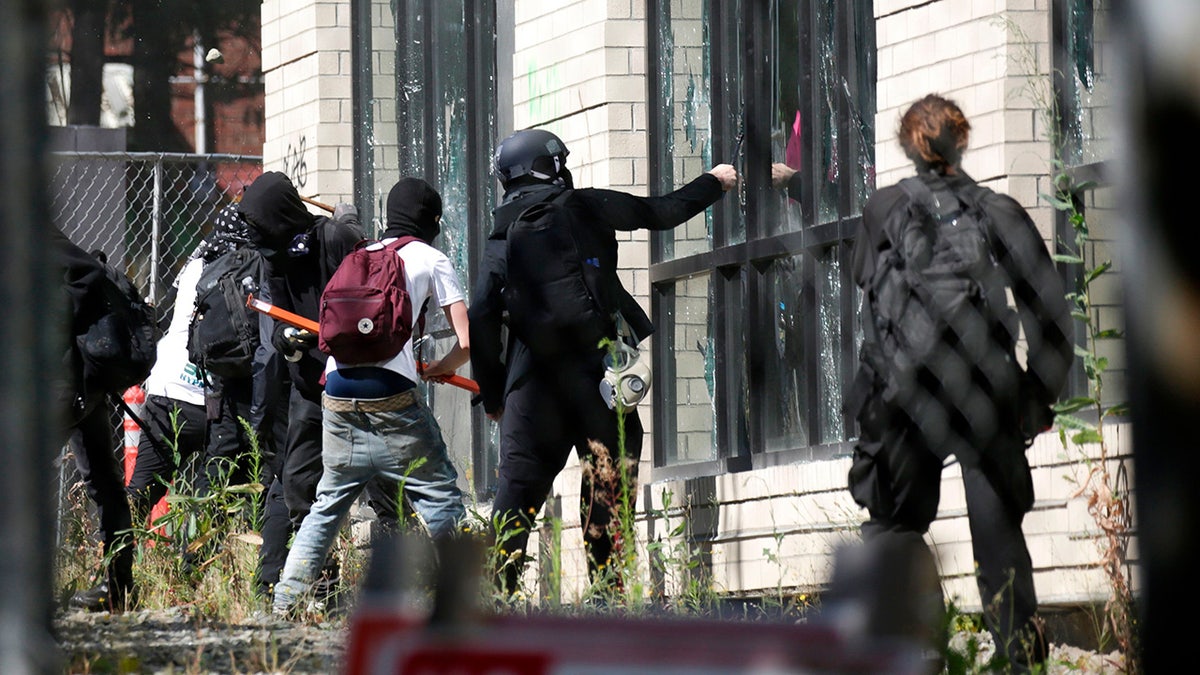 Protesters break windows in Seattle