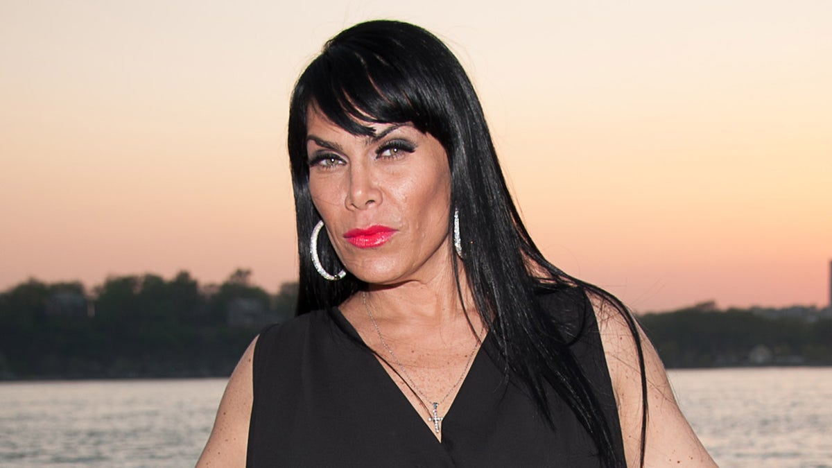 Mob Wives star Renee Graziano wears black dress next to harbor