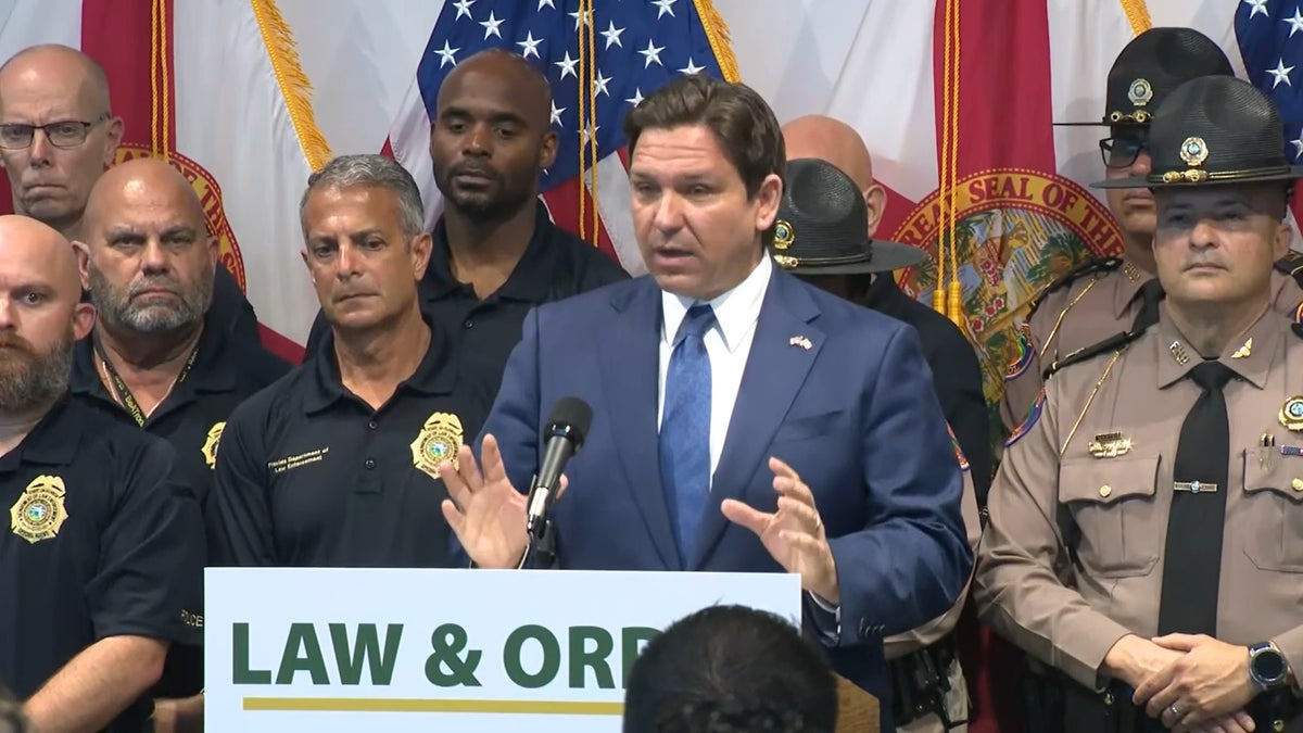 Ron DeSantis talks during a press conference