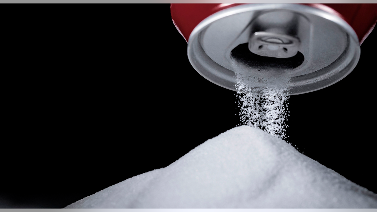 sugar poured from a soda can