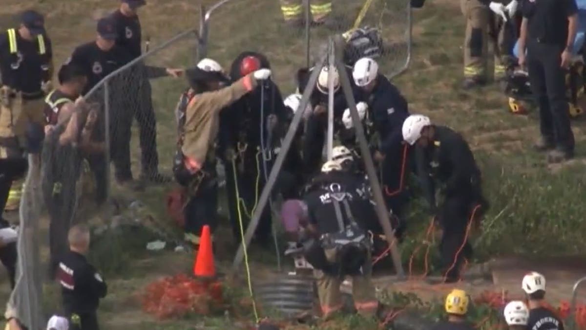 Fire department officials near well