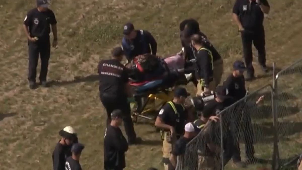 Aerial shot of woman on stretcher