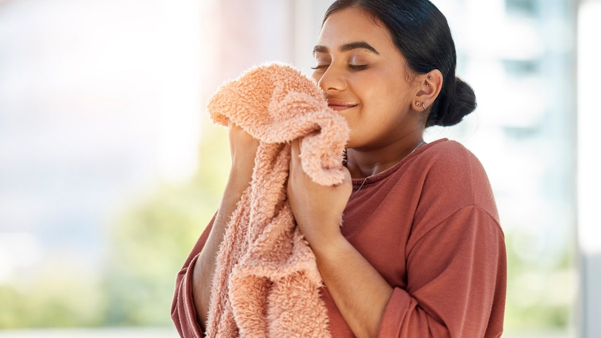 Woman smelling laundry