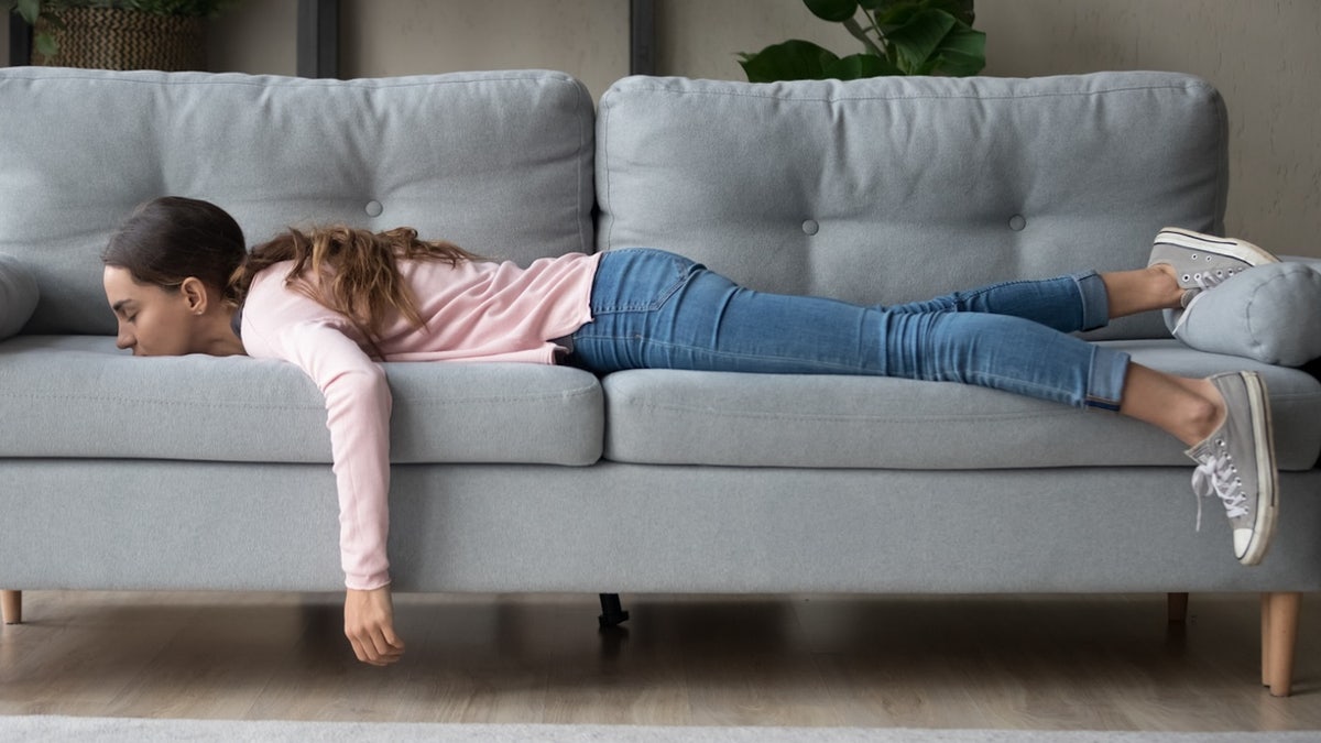 Woman tired on couch