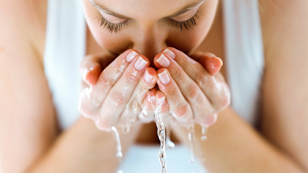 Woman washing face