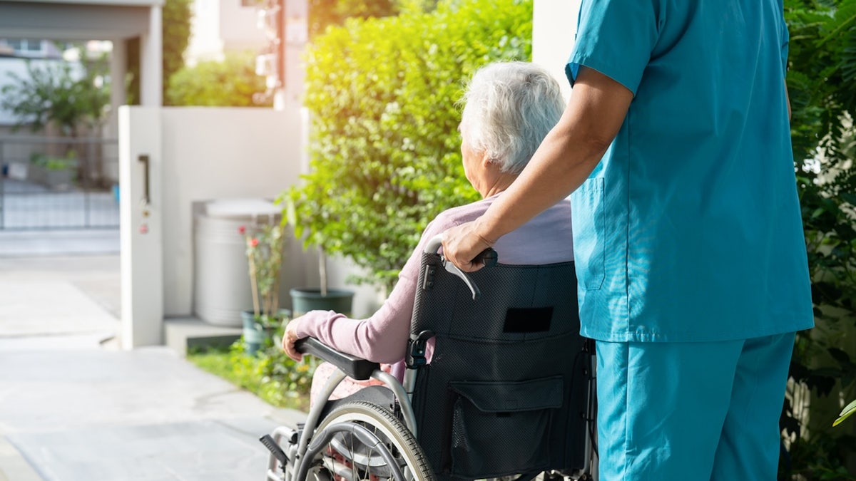 woman wheelchair nursing home