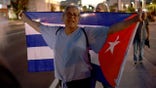 Adam Moreno joins people in the Little Havana neighborhood show their support for the protesters in Cuba on March 18, 2024, in Miami, Florida.