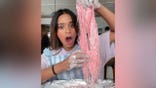 Woman holds homeade dragon's beard candy