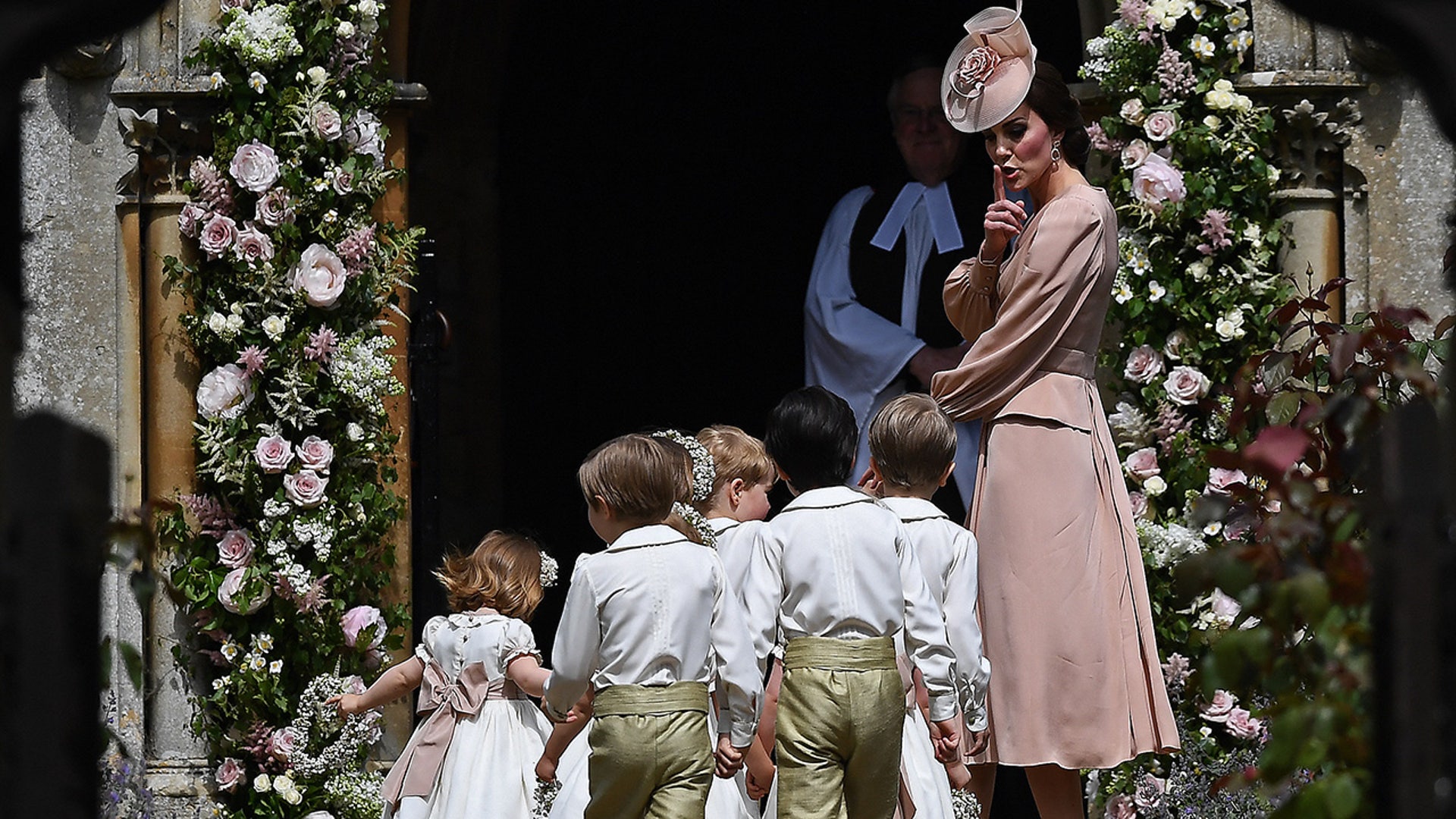Princess Catherine shushes the kids as they walk into church