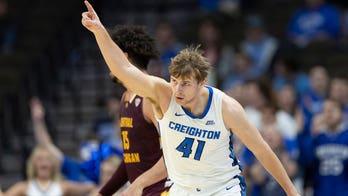 Creighton's Isaac Traudt monitors his glucose on the court to play college basketball with diabetes