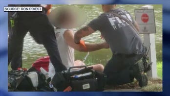 Fisherman hospitalized after giant alligator bites off his hand in Florida pond