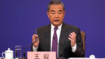 China's foreign minister accuses US of devising tactics to suppress China