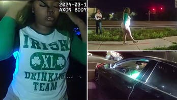 Green-haired St Patrick's Day reveler found passed out drunk behind car wheel: video