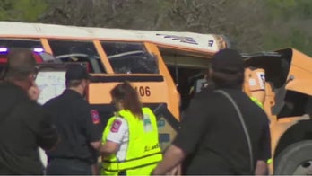 Texas school bus returning from field trip crashes, killing man and boy