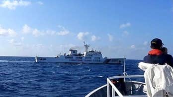 China's coast guard attempts to block Philippine vessels carrying scientists