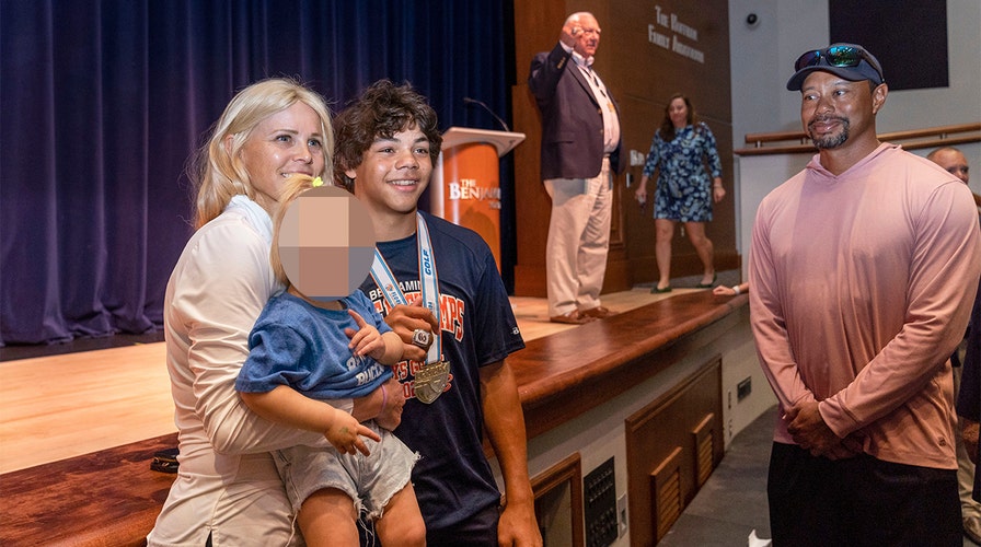 Tiger Woods, exwife Elin Nordegren briefly reunite to support son