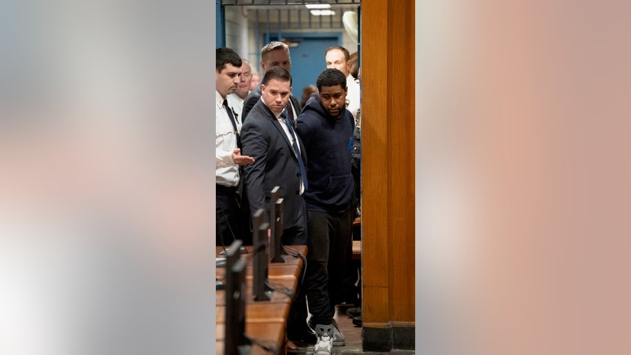 Jones being escorted in court