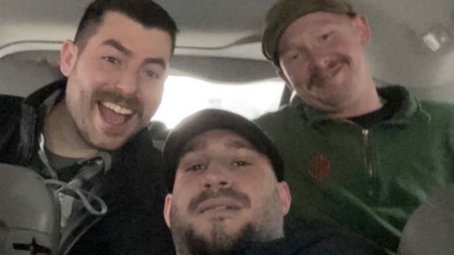 NYPD Officer Jonathan Diller smiles with colleagues