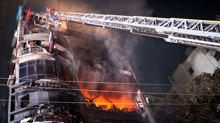 Shopping mall that caught fire, killing 46 people had no emergency exits, Bangladeshi leader says