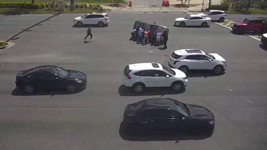Bystanders flip SUV after crash on busy Florida boulevard: video