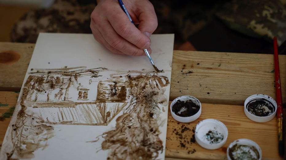 Ukrainian artist-turned-soldier uses mud and ash from the front lines to paint nature, war