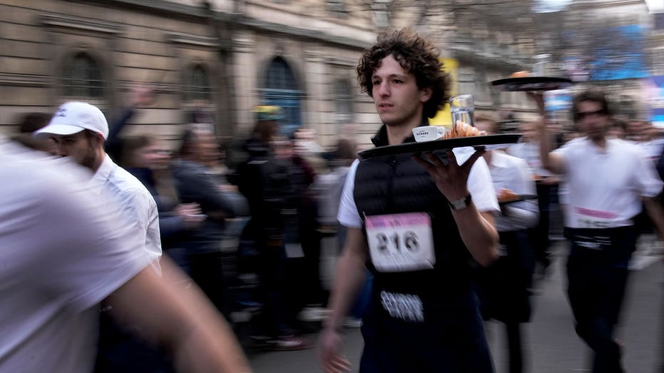 Paris waiters and waitresses dash to victory in revived 110-year-old racing tradition