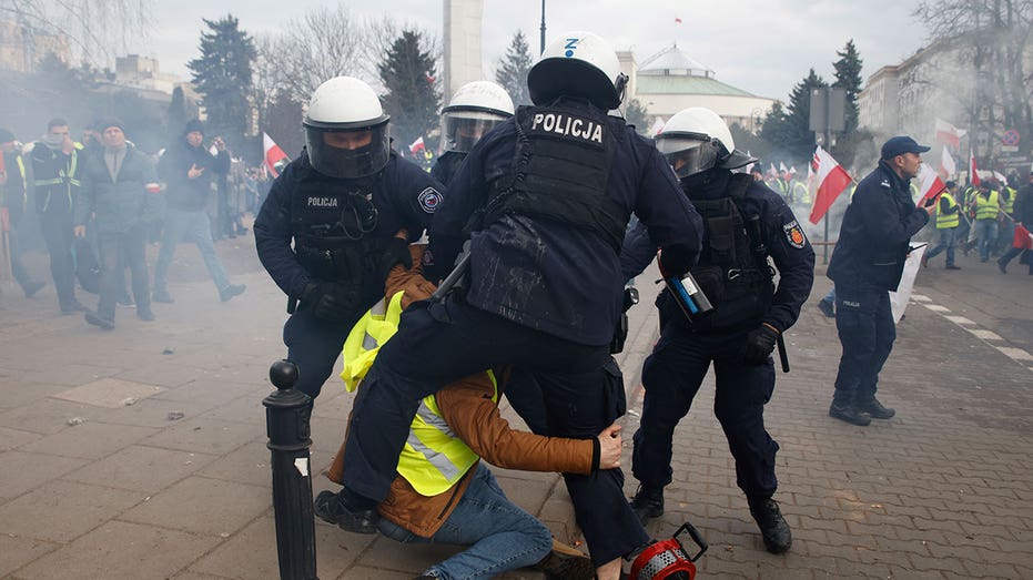 Polish government blames 'hooligans' for violent clashes as farmers protest Ukraine imports