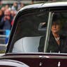 Princess Catherine looks out of the window of a limousine